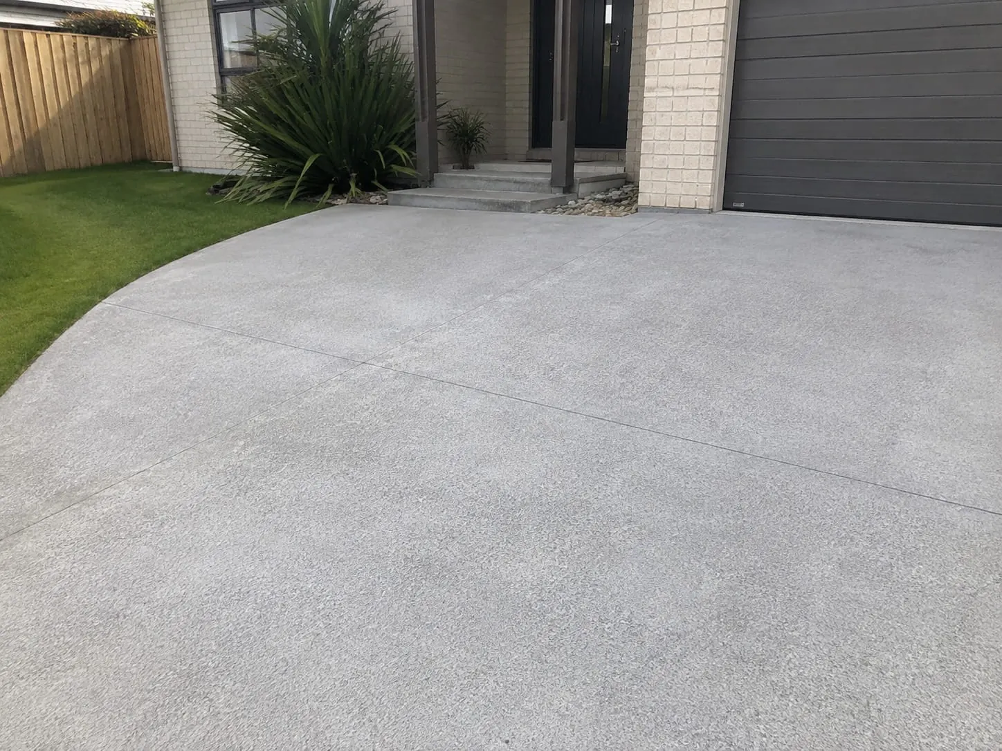 Newly installed concrete driveway at an Auckland home