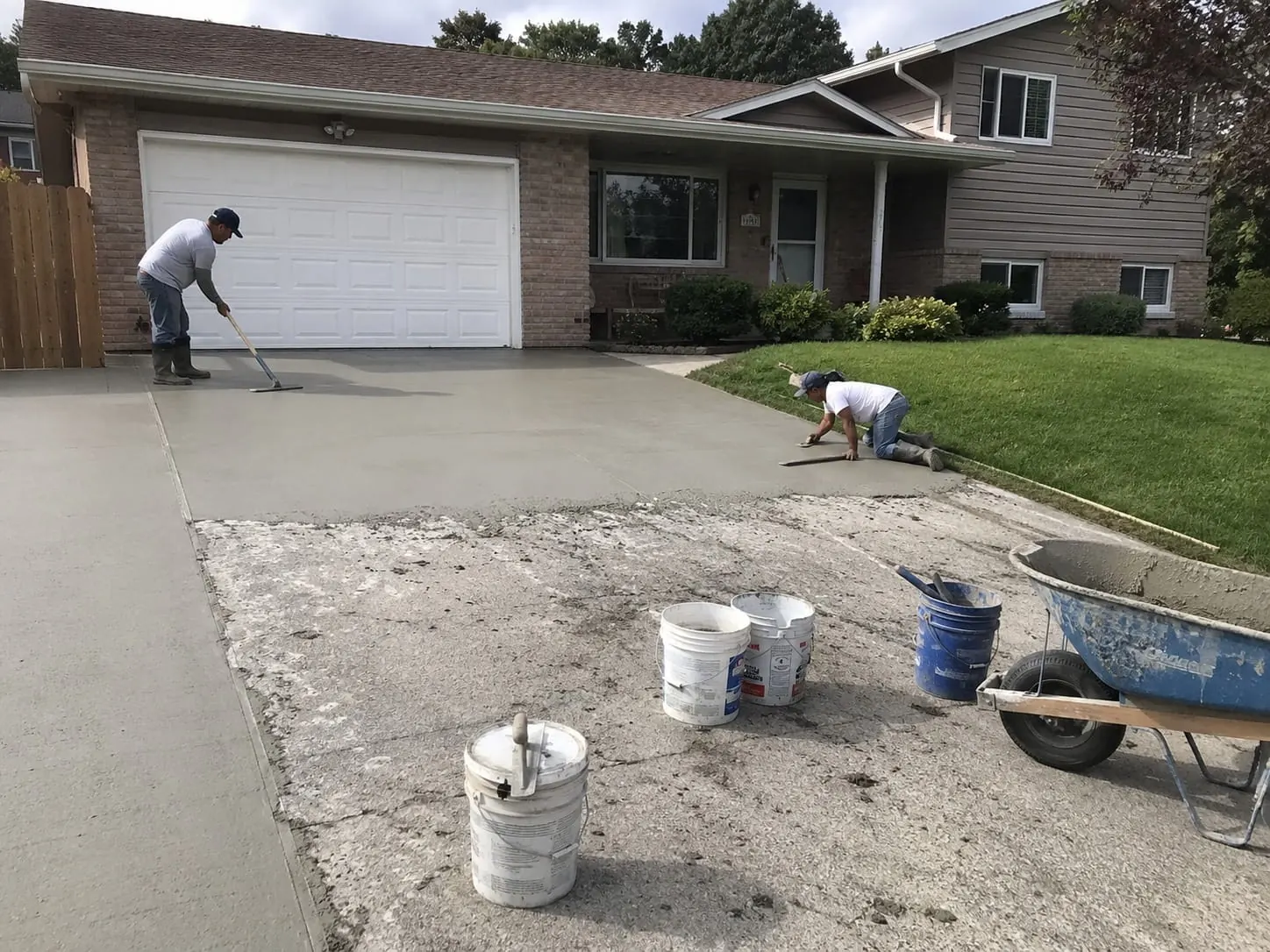 Concrete driveway repairs restoring a damaged slab