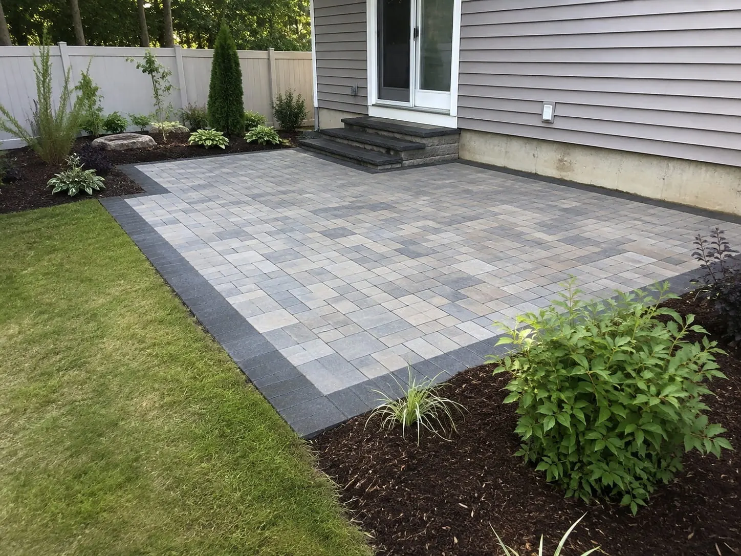 Concrete patio experts finishing an outdoor living area