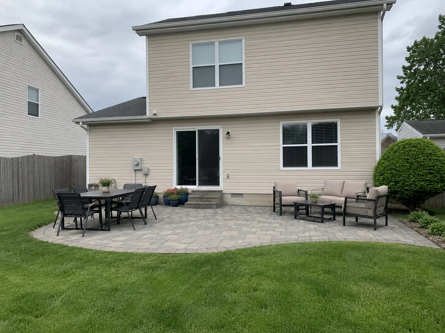 Concrete patio and outdoor living area at an Auckland home
