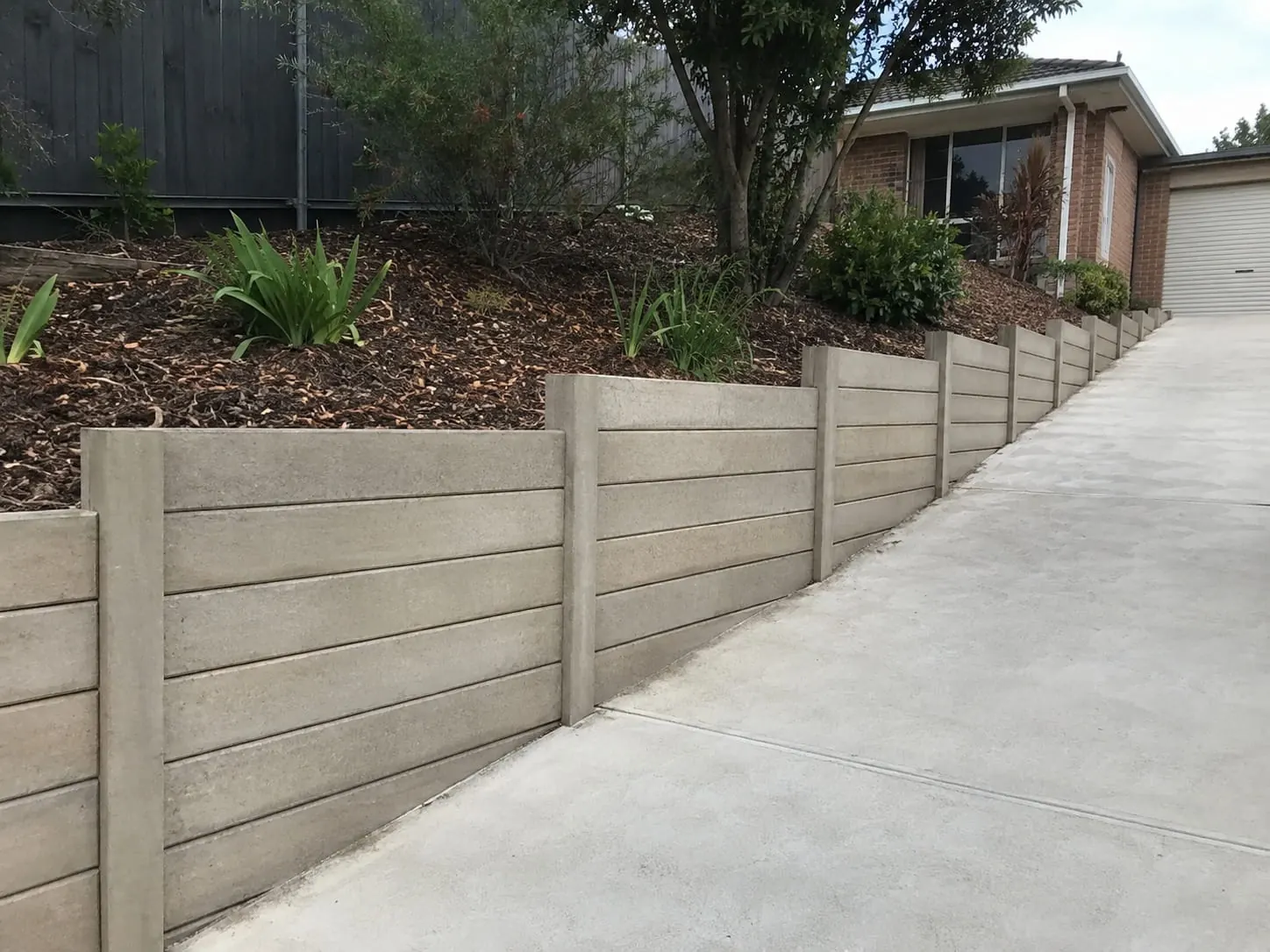 Concrete sleeper retaining walls on an Auckland property