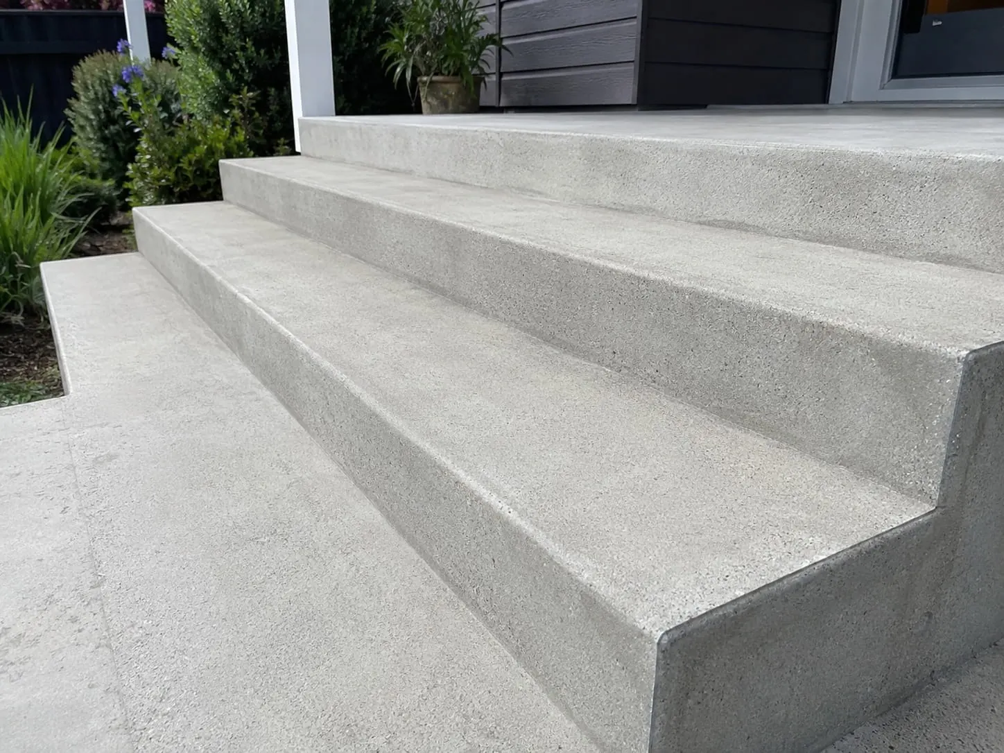 Concrete steps linking terraced levels on an Auckland property