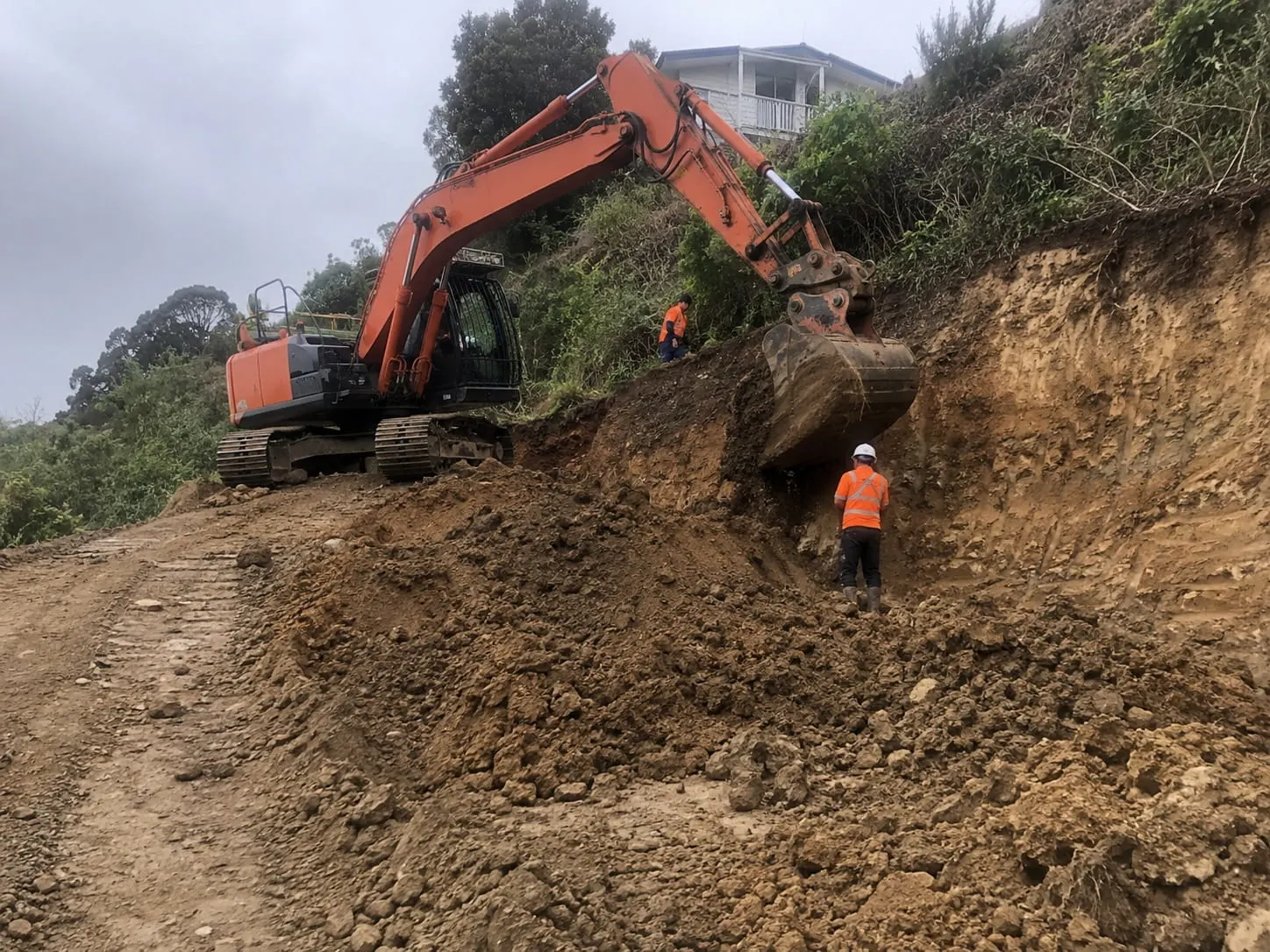 Auckland earthworks contractors preparing a site for a retaining wall