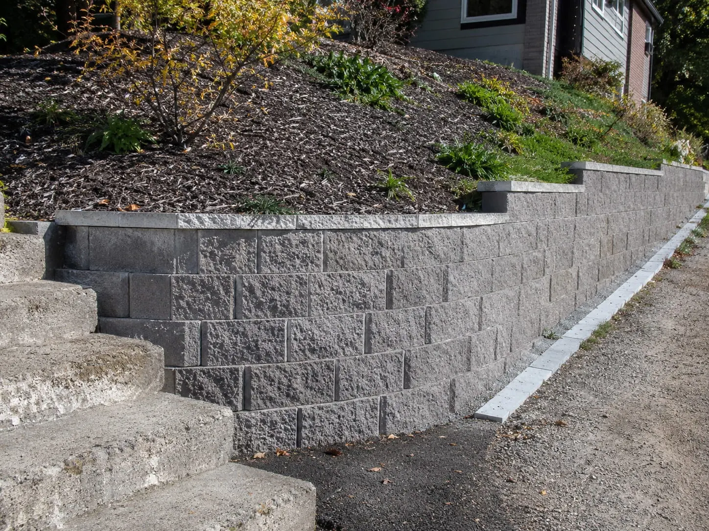 Finished Besser block retaining wall on an Auckland property