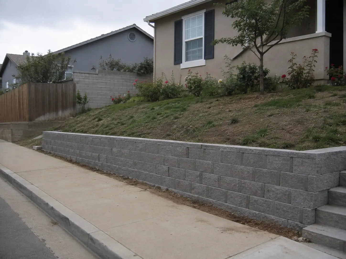 Besser block retaining wall contractors working on an Auckland site