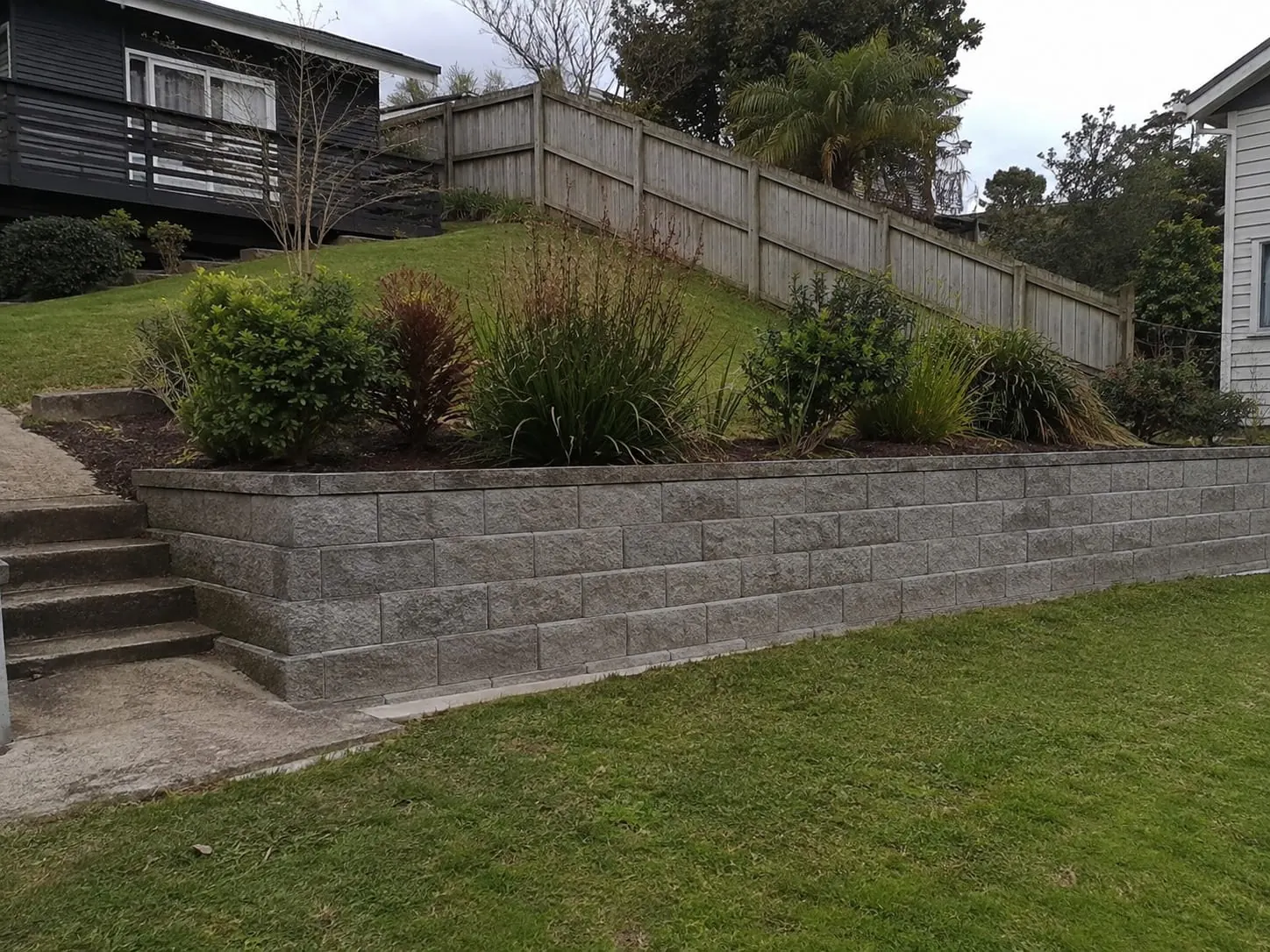 Concrete block retaining wall built on an Auckland residential section