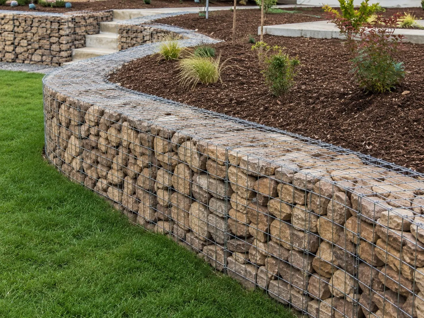 Gabion retaining wall on a steep bush section at Cornwallis, Auckland