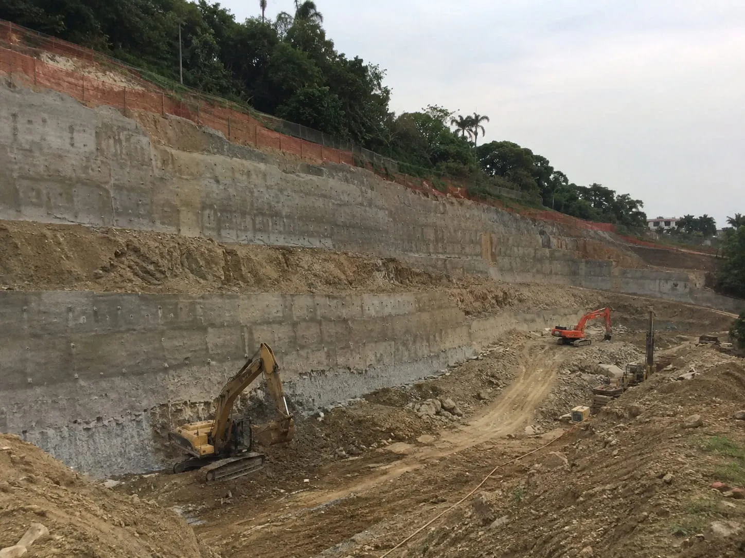 Benched commercial retaining wall excavation cut into a large Auckland site