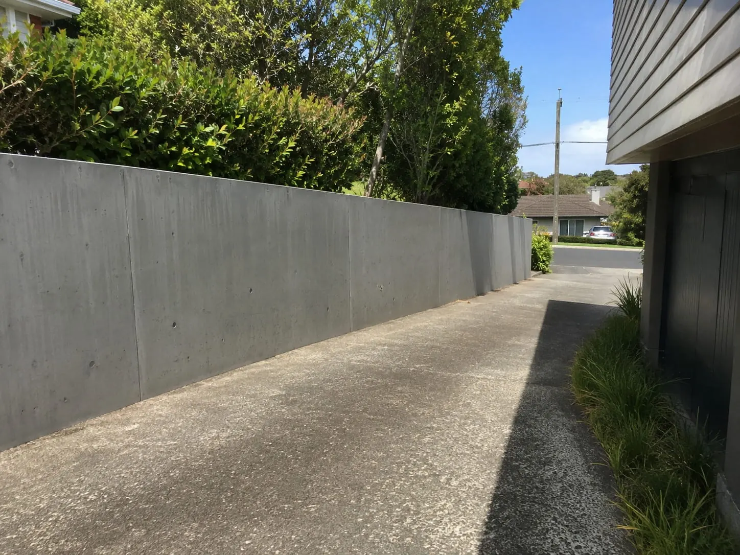 Poured concrete retaining wall built on an Auckland section