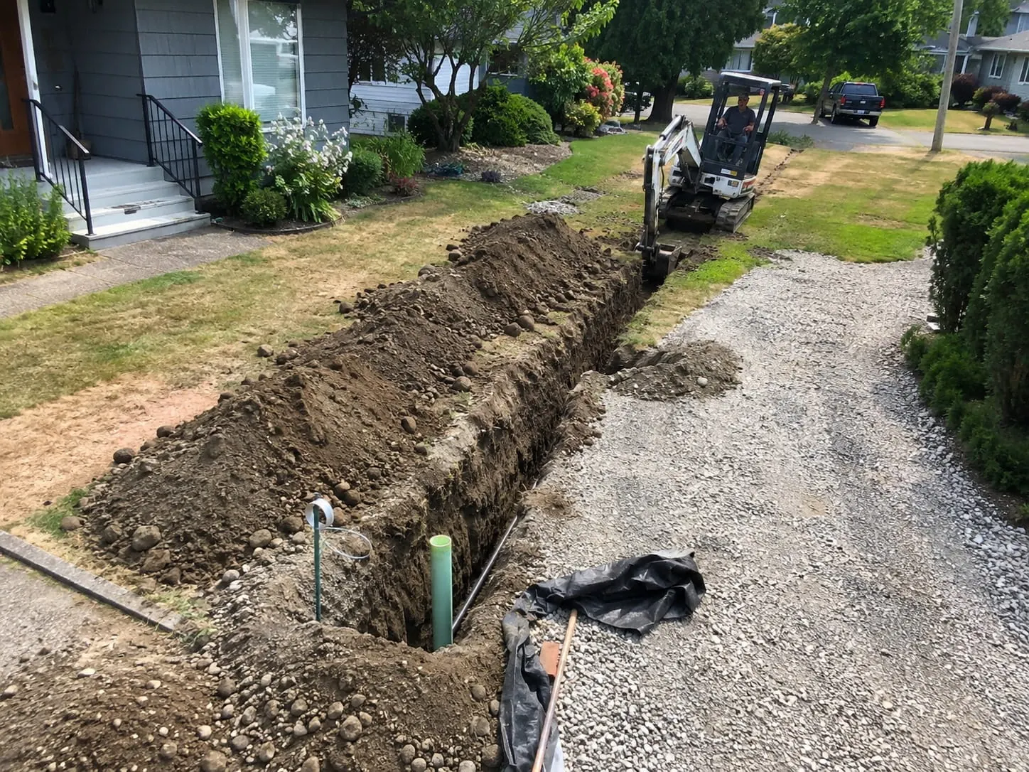 Trench excavation running across an Auckland property