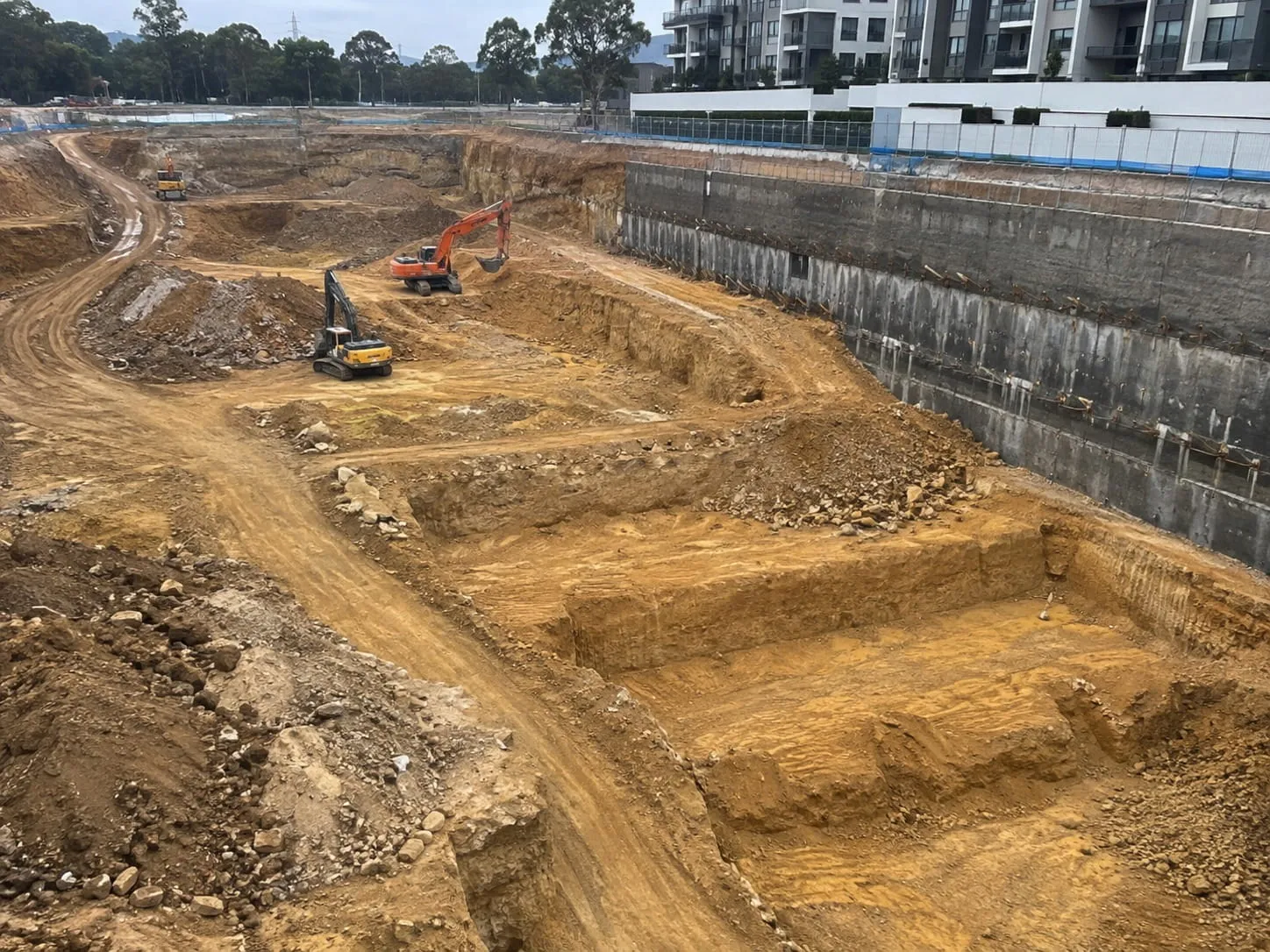 Bulk excavation and shored retaining wall beside an Auckland apartment development