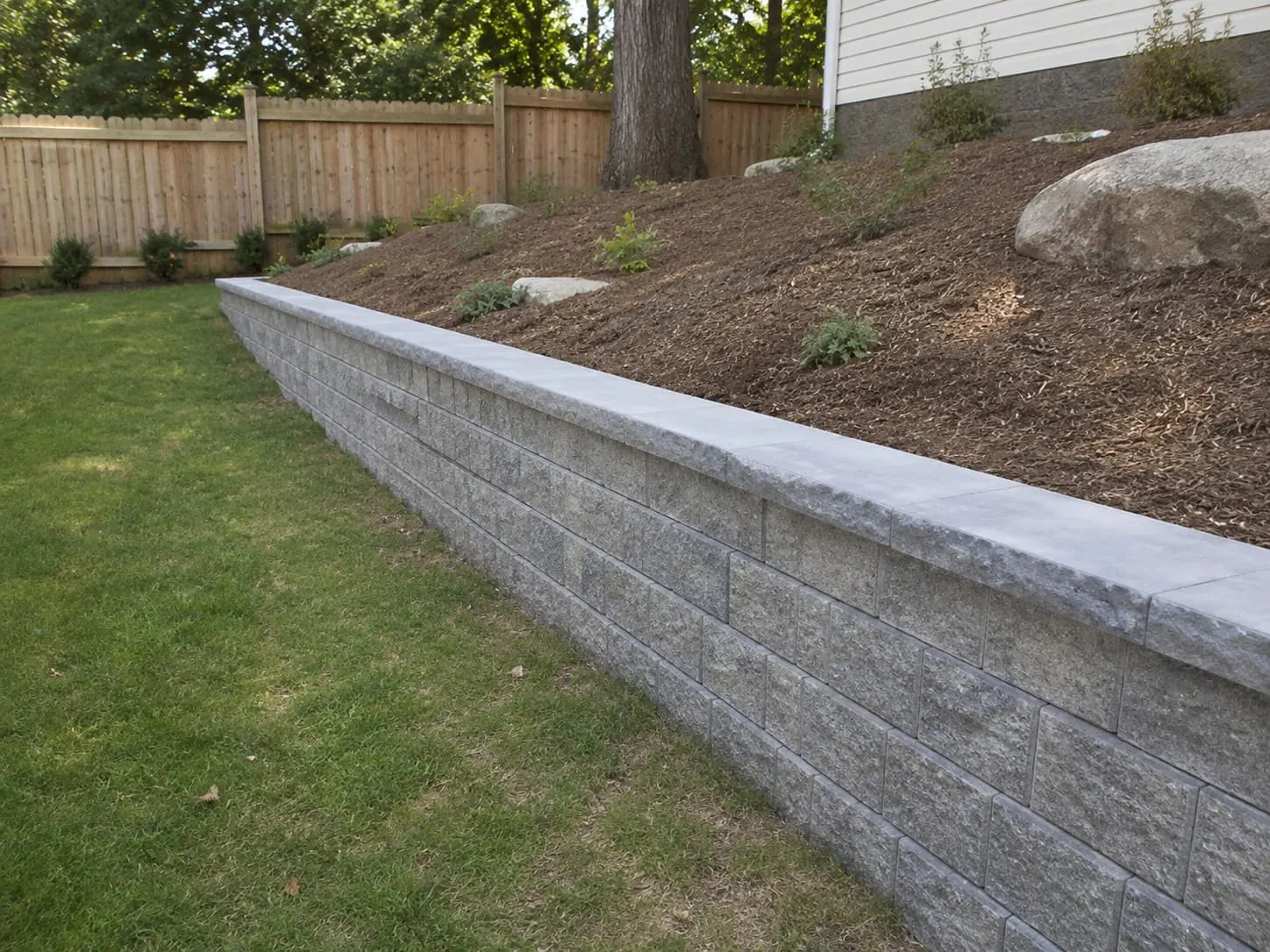 Stone veneer retaining wall on a cliff-top section in St Heliers, Auckland